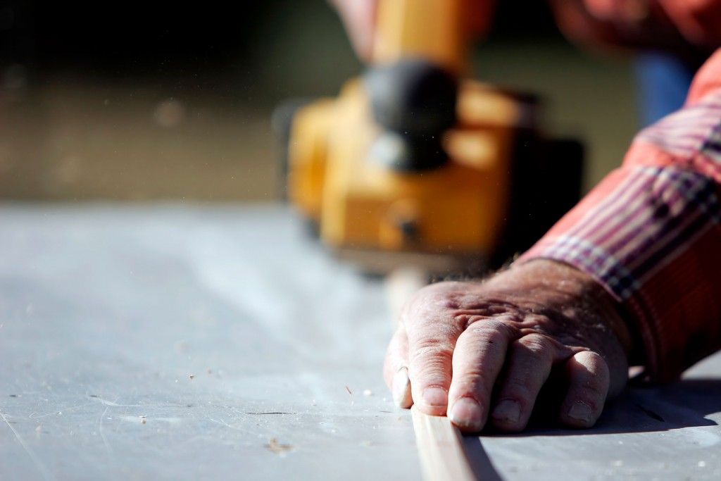 Worker using power tool