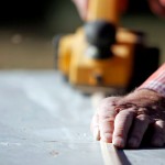 Worker Using Power Tool